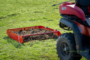 manure collector in paddock with atv